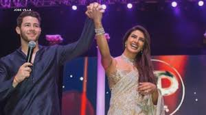 Priyanka chopra was glowing friday as she and nick jonas put their own spin on the traditional hindu mehendi party in india. Priyanka Chopra And Nick Jonas Look More In Love Than Ever In Wedding Reception Photos Entertainment Tonight