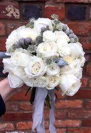 Beautiful Winter Wedding Bouquet Made With Garden Roses Silver Berries And Foliage Winter Wedding Bouquet Wedding Bouquets Wedding Flowers