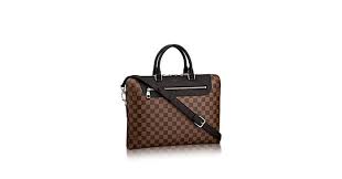 Discover Louis Vuitton Porte Documents Jour Richly Embossed Damier Ebene Adorns The Porte Documents Jour For The City Dwelling Porte Documents Sac Homme Sac