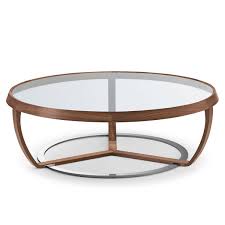 In the creation of driftwood coffee tables, the root system is inverted so the beautiful wood can be seen through the glass. Time Walnut And Glass Coffee Table Klarity Glass Furniture