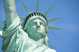 People taking pictures of magnificent sculpture. Hd Wallpaper Close Up Photo Of Statue Of Liberty New York Dom Liberty Island Wallpaper Flare