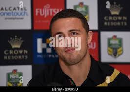 South Sydney Rabbitohs NRL Player Isaac Luke and former St George Dragon,  now Canterbury-Bankstown Bulldogs NRL Player Brett Morris, pose for a  photograph in the jersey of his new club, during a