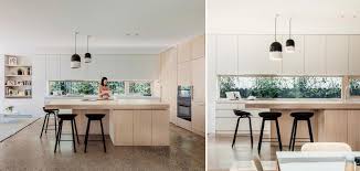 What is the best way to clean a kitchen countertop? A Long Horizontal Window Acts As The Backsplash Inside This Kitchen