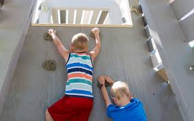 A calgary patriots cozy cover up robe for swimmers after climbing out the water. Ralph Klein Park Calgary Alberta Natural Wood Playground Mountain Sculpture Climbing Wall Earthscape Play
