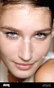 Anna Molinari Backstage Milan Ready to Wear S S Close up face of Russian  model Eugenia Volodina wearing false eyelashes, half Stock Photo
