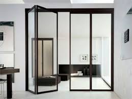 Folding Black Frame Glass Doors Separating The Kitchen And The Living Room Glass Doors Interior Folding Glass Doors Doors Interior