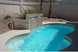 Small swimming pool with waterfall and slide at high resolution. Small Yard Small Pool 25 Tiny Pools Intheswim Pool Blog