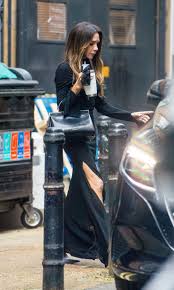 Victoria Beckham stuns in a sleek black dress with a daring ...