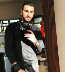 Image May Contain 1 Person Beard Phone And Indoor Men Sweater Beard Famous People