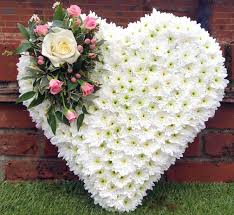 The arrangement needs to be classy, beautiful, personal and of the very highest quality. Heart Tribute Petal Stem Florists Farnham
