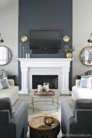 If you have a brick fireplace or a white fireplace, symmetrical mirrors are perfect accents, since their reflective surfaces will offer a dramatic look to match as well as provide visual balance. Tall Fireplace Wall Transformation With Paint Accent Walls In Living Room Tall Fireplace Fireplace Transformation
