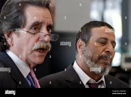 Attorney for 18-year-old Adel Daoud Thomas Durikn, left, and Daoud's father  Ahmed Daoud attend a news conference at the federal courthouse, Monday,  Sept. 17, 2012, in Chicago. Daud made an initial appearance