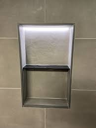 If my tile is 11 3/4″ square and i'm using a 1/8″ grout line then the inside dimension of my niche is going to be 23 7/8″ x 12″ (11 3/4 (tile) + 11 3/4 (tile) + 1/8 (grout line) + 1/4 (extra) high) x (11 3/4 (tile) + 1/4 (extra) wide). Niche Murale Avec Eclairage Led Integre Schluter Kerdi Board Nlt Schluter Systems