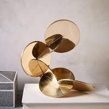 Hot Home Decor Trends To Watch Out For In 2017 Metallics Like Brass Antique Gold Bronze Onyx Mix Gold Modern Decorative Objects Sculpture Trending Decor