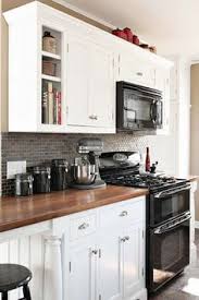 Black Appliances And White Or Gray Cabinets How To Make It Work Black Appliances Kitchen Kitchen Design Home Kitchens