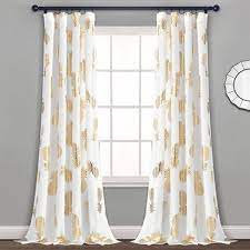 The curtain rod goes through the grommet holes so that the curtains can be moved on the rod. Pineapple Toss Window Curtain Panels Lush Decor Target