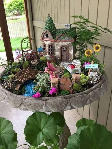 old bird bath turned whimsical garden