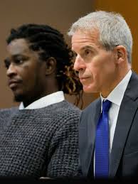 A judge said #YoungThug's attorney, Brian Steel, violated regulations by  obtaining information about a private meeting between the judge,  prosecutors, and a witness. Steel was held in contempt when he ...