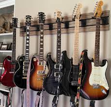 Helps to clear up floor space and keep your guitars within easy reach, and looking great. Guitar Wall Hangers Ever Had One Break My Les Paul Forum