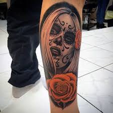This skull and rose tattoo looks beautiful due to the addition of leaves too. Day Of The Dead Tattoo 151 Amazing Designs Besttattooguide Com