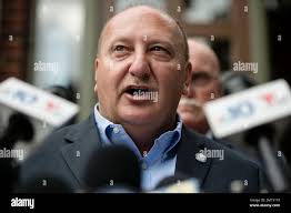Allentown Mayor Edwin Pawlowski reads a statement outside of his home in  Allentown, Pa., Wednesday, July 26, 2017. Pawlowski and former Reading  Mayor Vaughn Spencer have been charged with multiple counts of