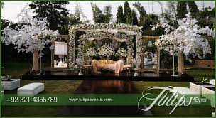 Tulips Event Best Pakistani Wedding Stage Decoration Flowering For Mehndi Walima Barat Stage Wedding Stage Design Stage Decorations Outdoor Wedding Reception