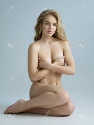 Sexy Fit Naked Woman With Healthy Clean Skin Sitting At Studio. Beautiful  Perfect Female Body Of Pretty Young Caucasian Girl. Stock Photo, Picture  and Royalty Free Image. Image 115550934.