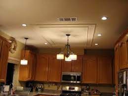 Kitchen fluorescent light makeover we removed old fluorescent. The Kim Six Fix How To Shave 30 Years Off Your Kitchen Recessed Lighting Kitchen Lighting Recessed Kitchen Lighting