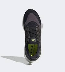 The newest member of the ultraboost family sees adidas double down on performance, incorporating a new torsion system for a more responsive run, more boost capsules, providing greater energy return and comfort, as well as an integrated primeblue textile made in part with parley ocean plastic. Adidas Ultraboost 21 Core Black Solar Yellow Fy0374 Sneakernews Com