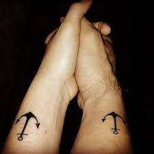 Anchor with heart tattoo on couple finger. 20 Cute Matching Anchor Tattoos For Couples Entertainmentmesh Anchor Tattoos Tattoos Couple Tattoos