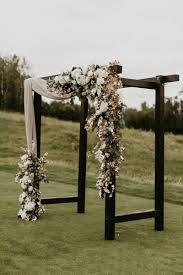 The expert florists at fancy flowers by michelle are committed to designing beautiful, quality arrangements and providing exceptional customer service to our. Elegant Black And Emerald Green Wedding From Edmonton Alberta Calgary Wedding Arches Outdoors Wedding Arch Wedding Arch Flowers