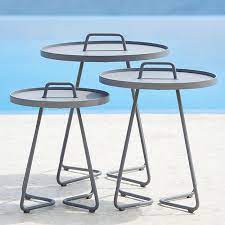Orange top, white frame, outdoor side table*matching table to slatted outdoor arm chair. Cane Line On The Move Side Table
