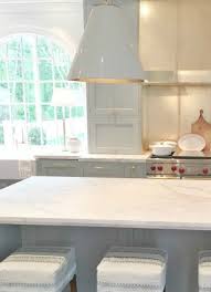 Overall view of the kitchen in the open, transitional design featuring inset, shaker, painted cabinetry. Light Blue Farrow Ball Paint Color Tranquil Inspiration Now Hello Lovely