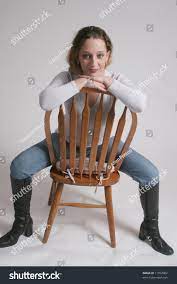 Sitting on a chair backwards