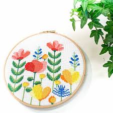 Stitching cross country means that every stitch in the whole pattern for one color is completed before moving on to the next one. Spring Flower Hoop Cross Stitch Kit Studio Koekoek