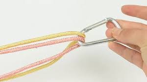 Firstly for this what you do is cut two strings of equal length.both strings may be of same or different colors.take one of the string and find the middle of that and wrap it. 3 Ways To Make Lanyards Wikihow