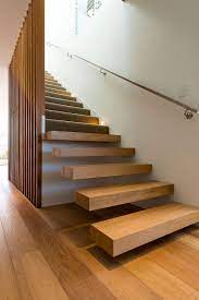 Single Level 60 S Sydney Home Gets A Beachy Modern Upgrade Wooden Staircases Wooden Staircase Design Wooden Stairs