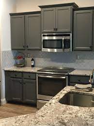 Remodeled Kitchen Painted Cabinets For An Inexpensive Fix To Builder Grade Cabinets Slide In Stove Ge Boardwalk Tile Backsplash Backsplash Glass Backsplash