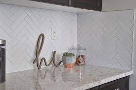 Thanks to the pattern's prominent peaks and valleys, the tile treatment draws the eye up, down, and around a room's perimeter. Herringbone Subway Tile Backsplash Reveal Okayest Moms