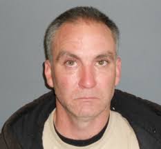 Man arrested after delivery truck is stolen with driver in back