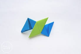 Then, fold the paper in half lengthwise. How To Make An Origami Ninja Star Step By Step Tutorial Mombrite