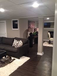 Basement Remodel Love The Dark Floors Different Ceiling Tiles Are Nice And The Framed Out Post Looks Good Home Basement Remodeling Small Basement Remodel