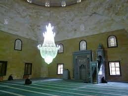 One can make i'tikaf in one masjid and lead tarawîh in another provided when sitting for i'tikaf this intention was made. Detailed Rules Of I Tikaf Seclusion In The Mosque