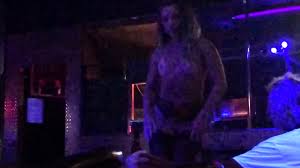 Groping strippers on stage.