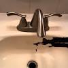 Learn how to fix this by replacing putty under the lip of the strainer from this home depot guide. 1
