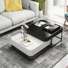 The tabletop and base offer plenty of storage space. China Living Room Furniture Hot Sale Nordic Ins Style Creative Flexible Fashion Black White Carbon Iron Feet Modern Simple Square Glass Top Coffee Table China Glass Top Coffee Table Square Coffee Table