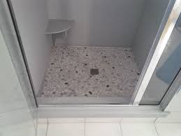 This Custom Shower Offered A Pebble Floor With A Corian Wall Surround Note Decorative Foot Perch Which Was Corian Shower Walls Shower Wall Panels Shower Wall