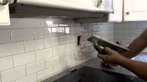 Grout the tile backsplash to avoid scratching the glass tiles, grout with unsanded grout. Grout Application On A Kitchen Backsplash Youtube