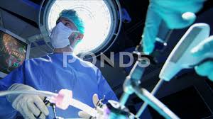 Medical Caucasian Surgical Team In Scrubs Performing Laparoscopy Surgery On The Stock Footage Team Scrubs Surgical Medical Medical Scrubs Stock Video