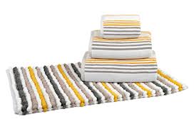 Each designer bath mat features textured cotton woven into thick loops to boost absorbency while feeling divine underfoot. Mustard Grey Bathroom Trend Allure Bath Fashions